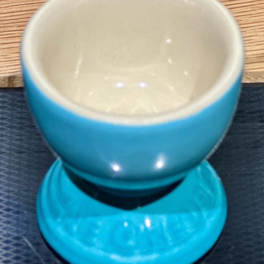 NWT Le Creuset footed egg cup in the color Caribbean. Please see photos.